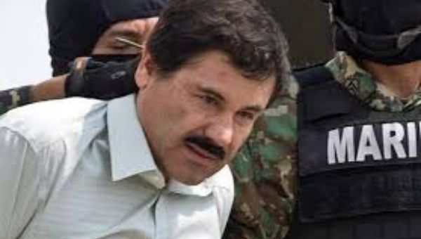 El Chapo Guzman escorted by soldiers after he was detained in February of 2014. 