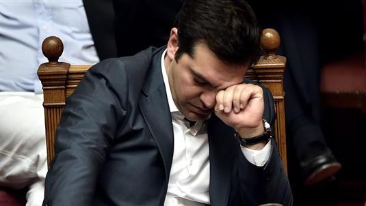 Greek Prime Minister Alexis Tsipras reacts during a parliament session in Athens on July 15, 2015.