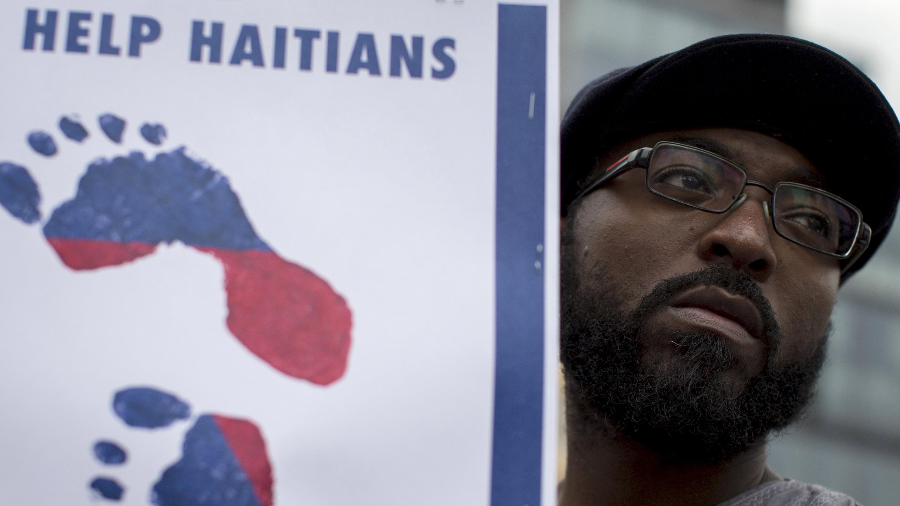 A man attends a demonstration calling for the Dominican Republic to restore citizenship to Dominicans of Haitian descent in New York July 2, 2015.