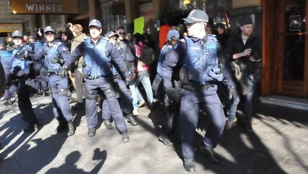 Police say they used pepper spray to quell rowdy protesters, but medics say they provoked further unrest.