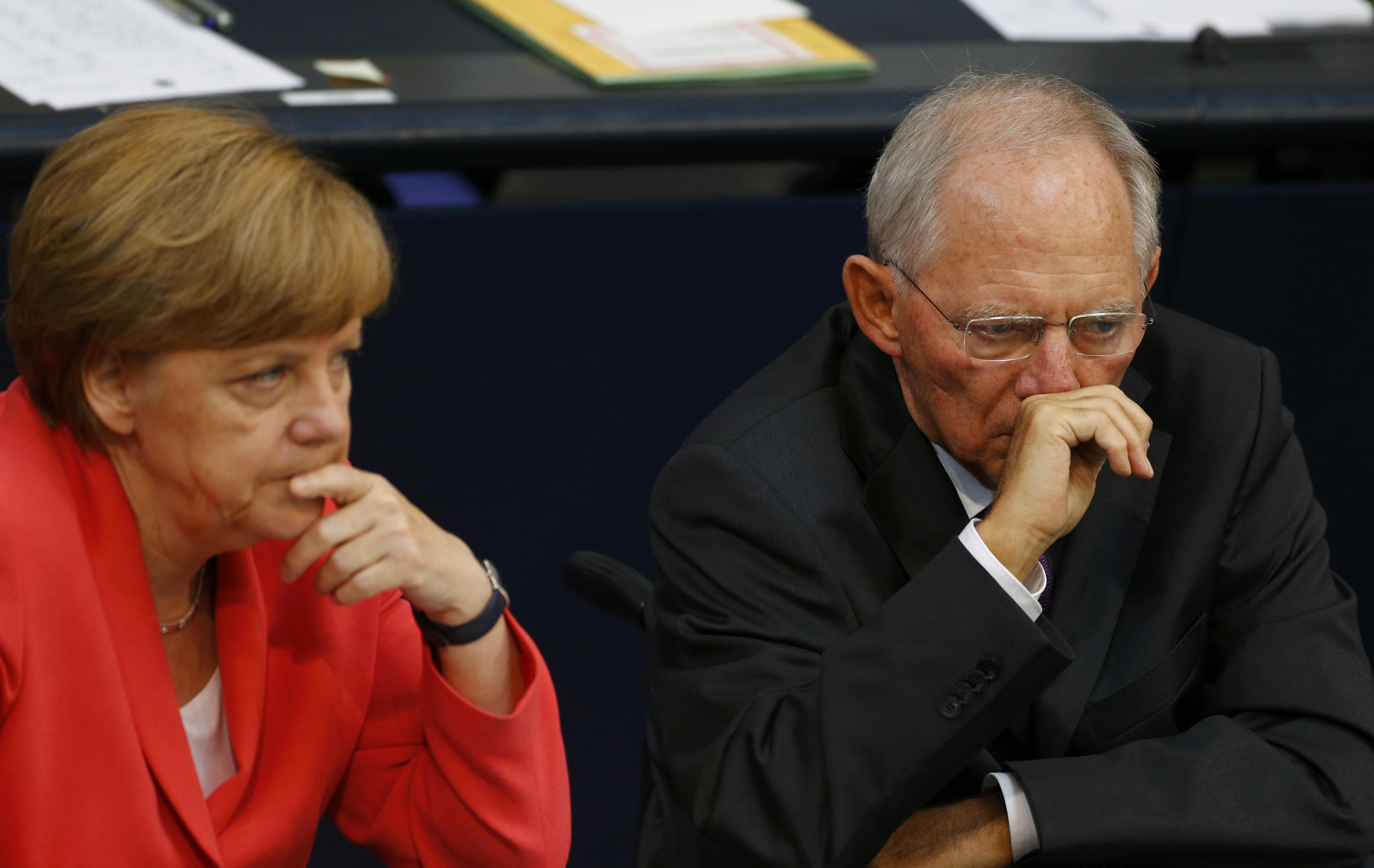 German Chancellor Angela Merkel and Finance Minister Wolfgang Schaeuble attend the session of Germany's parliament, the Bundestag, in Berlin, Germany, July 17, 2015.
