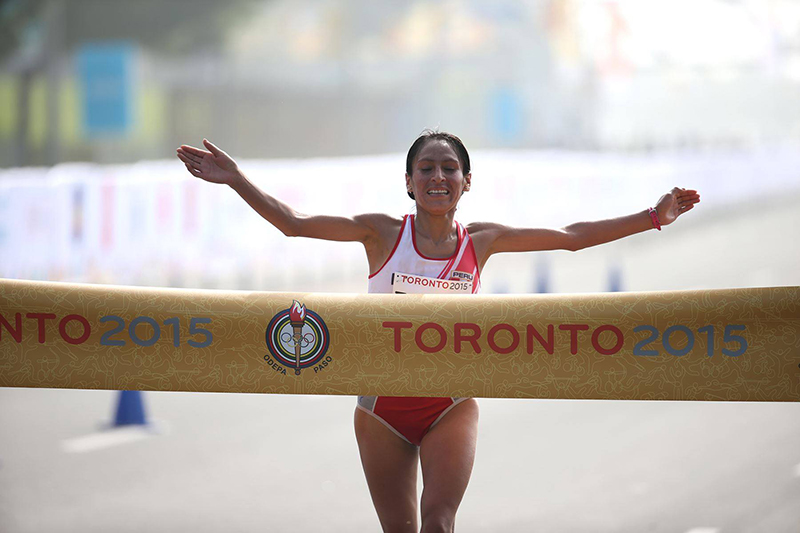 Gladys Tejeda reaching the finish line for gold medal