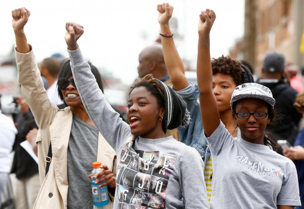 People celebrate as they gather in the streets of Baltimore, May 1, 2015