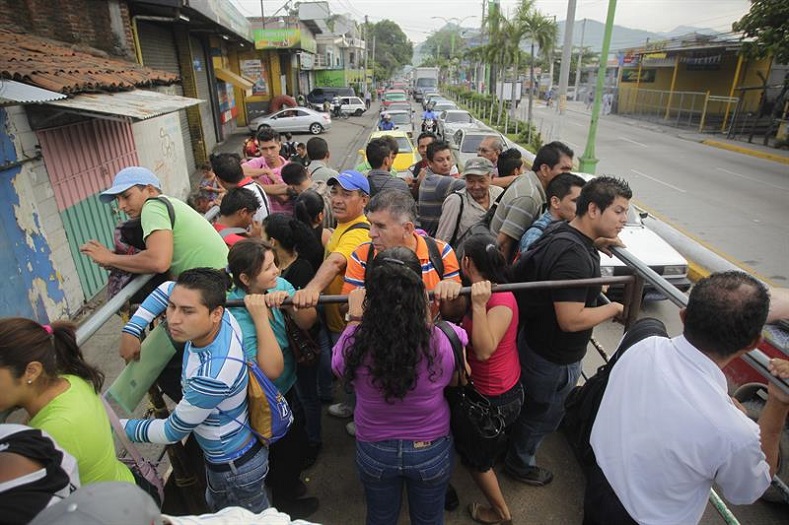 Dozens of Salvadorans travel by alternative means as transportation workers strike in San Salvador, July 28, 2015.