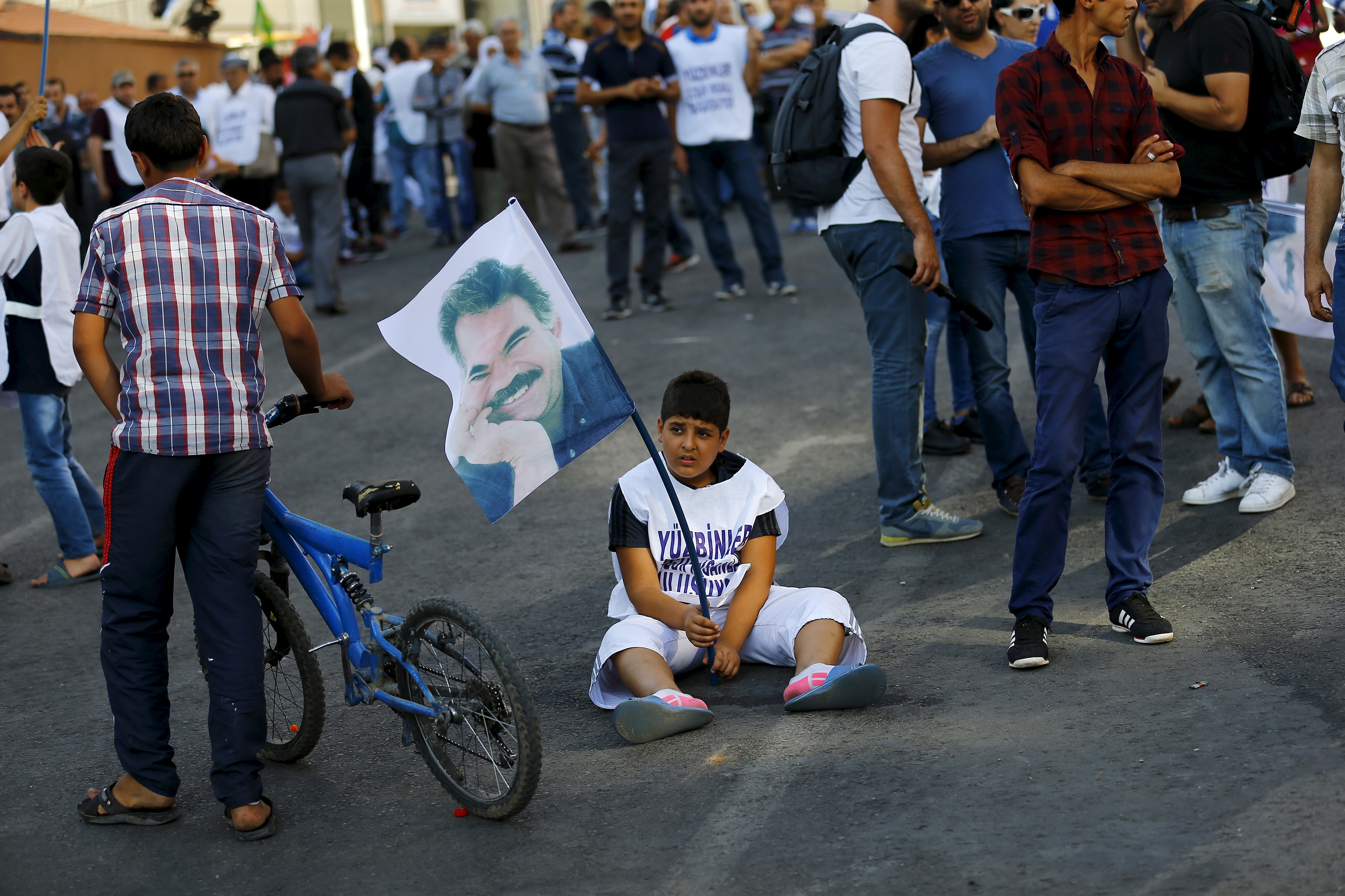 A demonstrator holds a portrait of Kurdistan Workers Party (PKK)'s jailed leader Abdullah Ocalan during a march in solidarity with him in Diyarbakir, Turkey.