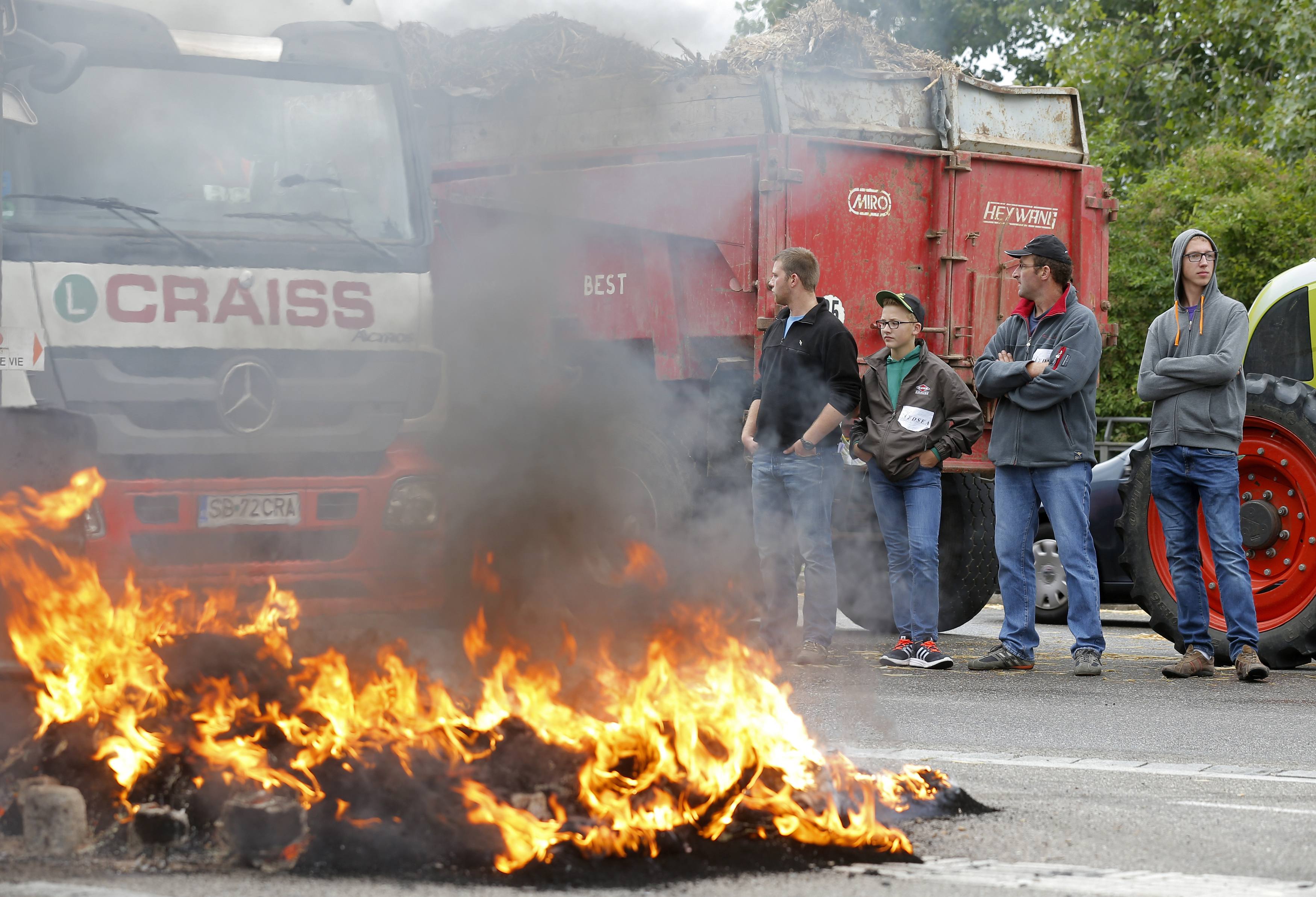 French farmers block trucks that transport food goods coming from foreign countries at the French German border in Strasbourg, France, during a protest against a squeeze in margins by retailers and food processors.