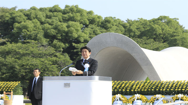 Prime Minister Shinzo Abe spoke, while demonstrators shouted slogans against the re-militarization of Japan.