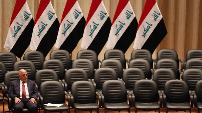 Haider al-Abadi attends a parliamentary session that approved the new government he heads in Baghdad on Monday.