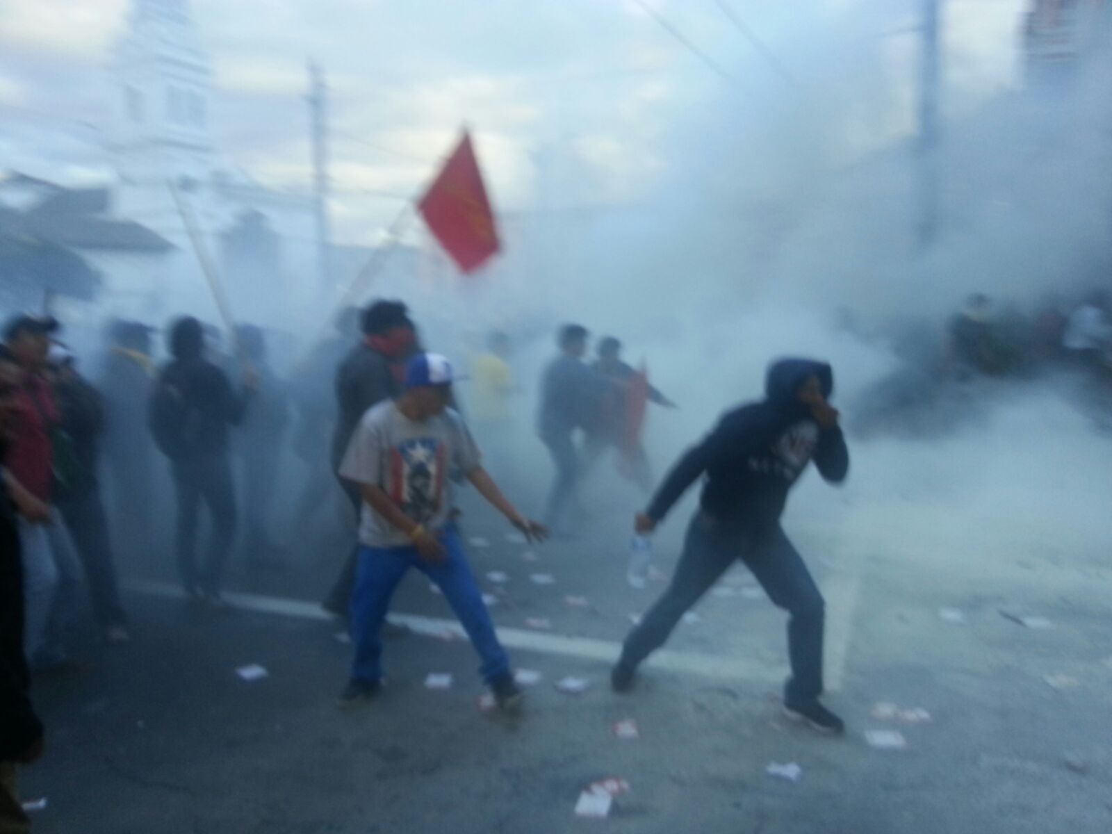 Masked opponents provoke violent clashes with the police on Santa Domingo Square in Quito.