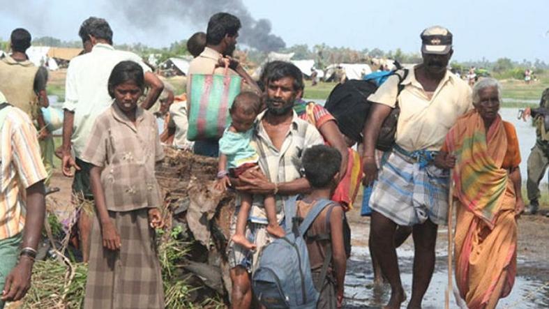 Civilians try to escape fighting between the Sri Lanka army and Tamil Tigers in 2009.