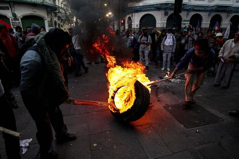 Protesters setting fire to tires.