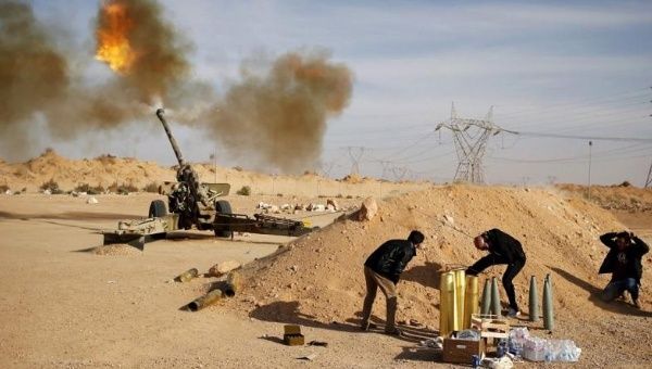 Libya Dawn fighters fire an artillery cannon at Islamic State group militants near Sirte in this file photo taken on March 19, 2015.