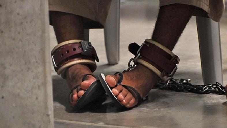A Guantánamo detainee's feet are shackled to the floor as he attends a life skills class inside Camp 6 in 2009.