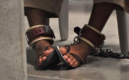 A Guantanamo detainee's feet are shackled to the floor as he attends a life skills class inside camp 6 in 2009.
