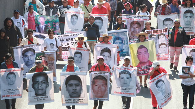 Relatives of the 43 disappeared students from Ayotzinapa demanding answers to the government