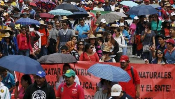 Members of the CNTE teacher's union take part in a march along Reforma Avenue in Mexico City June 1, 2015.