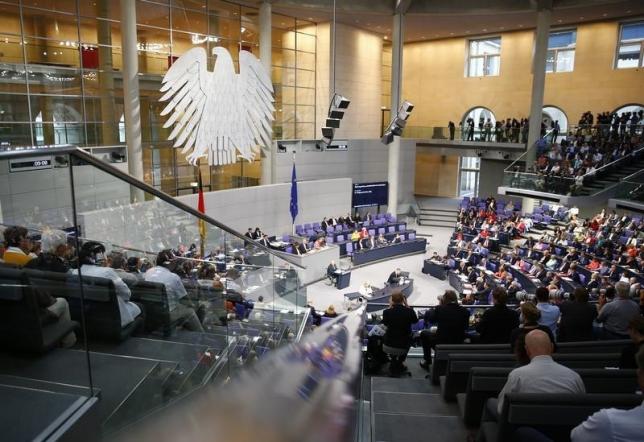 German Finance Minister Wolfgang Schaeuble (C) addresses a session of Germany's Parliament, the Bundestag, in Berlin, Germany, August 19, 2015, prior to a vote on Greece's third bailout program.