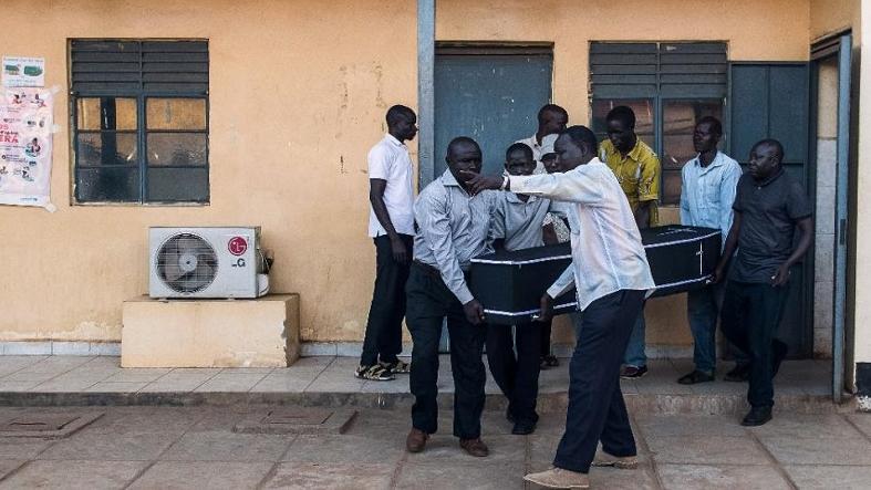 Relatives of slain journalist Peter Moi carry his coffin from the mortuary to a waiting car in the South Sudanese capital Juba on August 20, 2015.