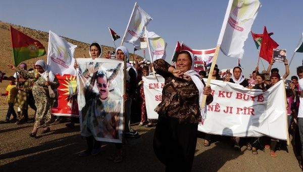 Protest march of Yazidi women in the Sinjar Mountains on the first anniversary of the Islamic State group massacre