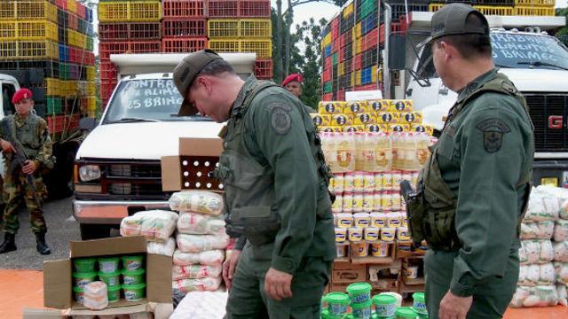 File photo of Venezuelan troops with confiscated contraband. Smuggling has been a major problem on the Venezuelan-Colombian border for years.