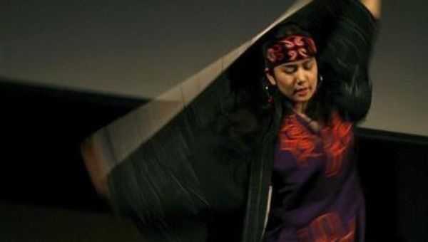 An Ainu woman performs at the 2008 Indigenous Peoples Summit in Sapporo, Hokkaido. Speaking Ainu was repressed in the past, but there are now efforts to reverse this.