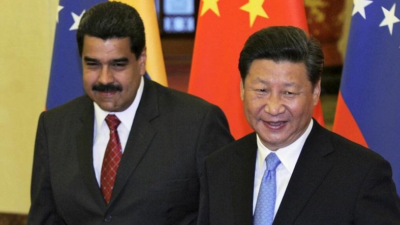 China’s President Xi Jinping (R) and Venezuela’s President Nicolas Maduro before their meeting at the Great Hall of the People in Beijing, China, Sept. 1, 2015.