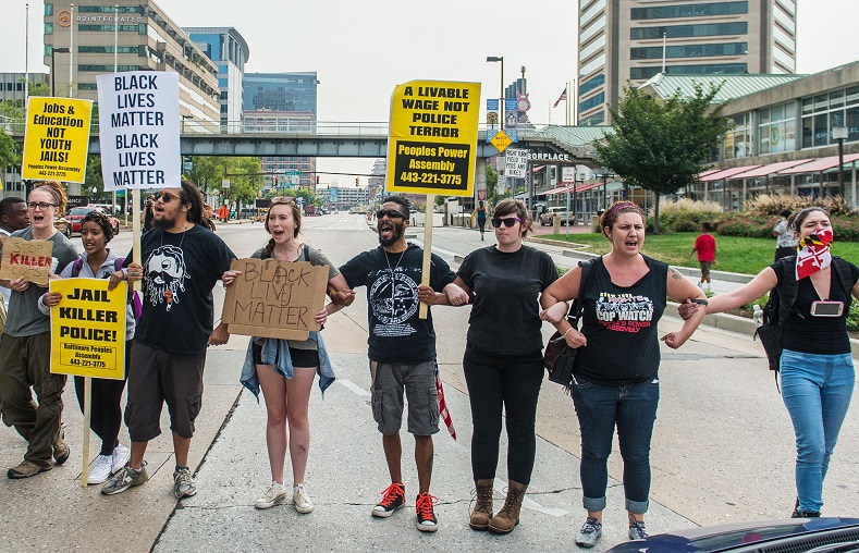 Protesters block traffic on Pratt Street as protests moved into the street on the first day of pretrial motions for six police officers charged in connection with the death of Freddie Gray in Baltimore, Maryland September 2, 2015.