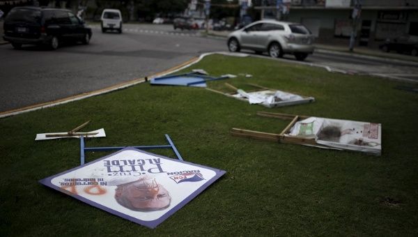 Campaign signs are pictured on the ground before Sunday's presidential election in Guatemala City, Guatemala September 5, 2015.