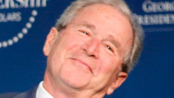 Former U.S. President George Bush has a mansion and is looking real happy.
