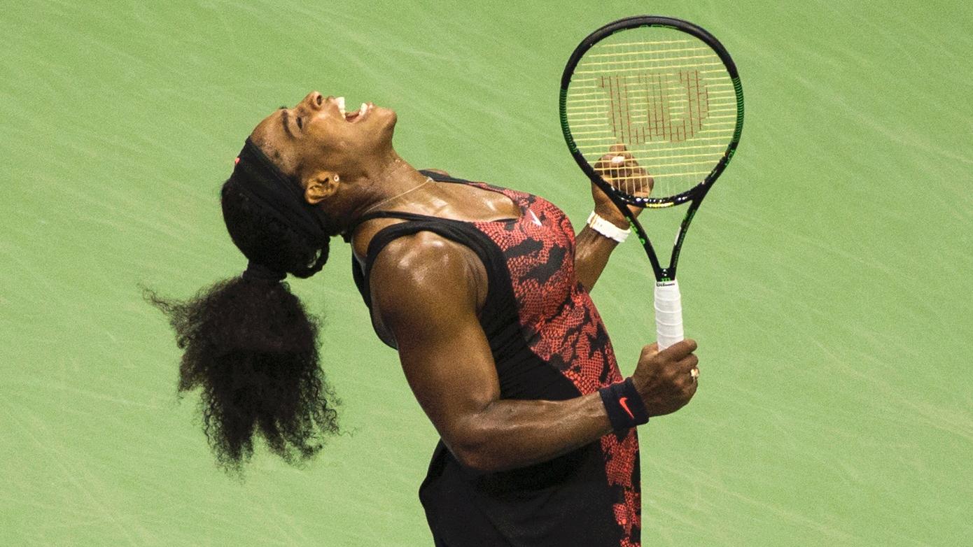 Serena Williams celebrates after defeating her sister Venus Williams in their quarterfinals match at the U.S. Open Championships.