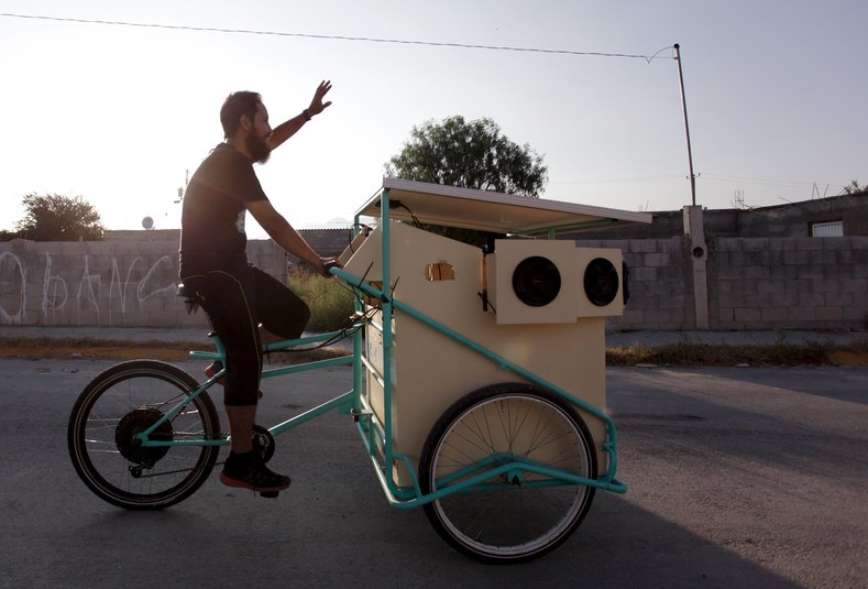 Reginaldo Chapa pedals his Cinecleta, Moviebike, through the streets of Saltillo, Mexico, Sept. 6, 2015.