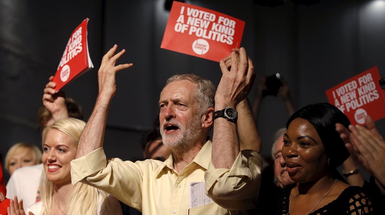 Labour Party leadership candidate Jeremy Corbyn gestures with supporters during a rally in London, Britain Sept. 10, 2015.