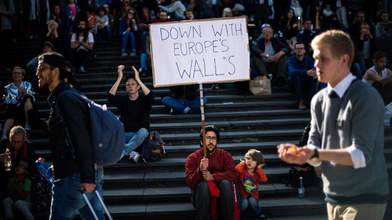 Demonstrators in Stockholm join tens of thousands of people who rallied in a Europe-wide day of action in solidarity with refugees and other migrants.