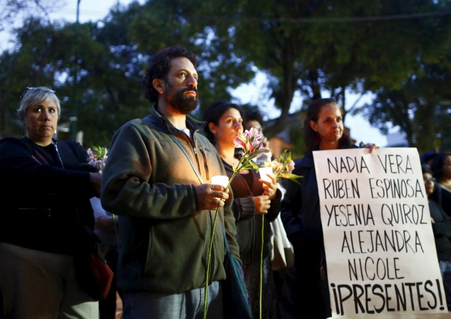 Activists mourn the deaths of the victims murdered with journalist Ruben Espinosa.