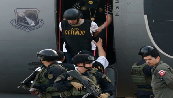 Gerald Oropeza Lopez was transferred to Peruvian authorities, handcuffed and wearing a bullet proof vest.