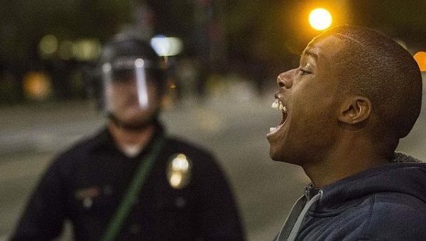 A man cries out during an anti-racism march in Ferguson.
