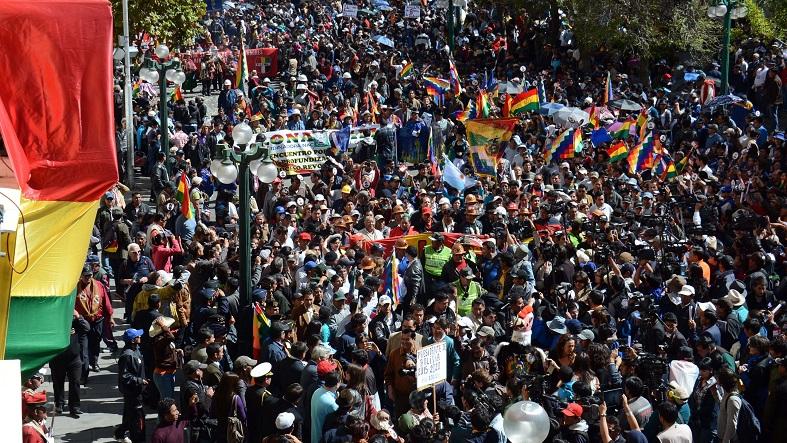 Bolivians march through the streets of La Paz to hand deliver their request that term limits for the president and vice-president be eliminated, September 17, 2015.