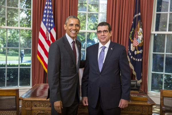 The newly appointed Cuban Ambassador Jose Ramon Cabanas (L) was greeted by U.S. President Barack Obama