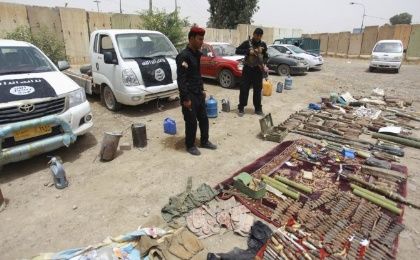 Iraqi security forces display vehicles and weapons seized from the Islamic State group