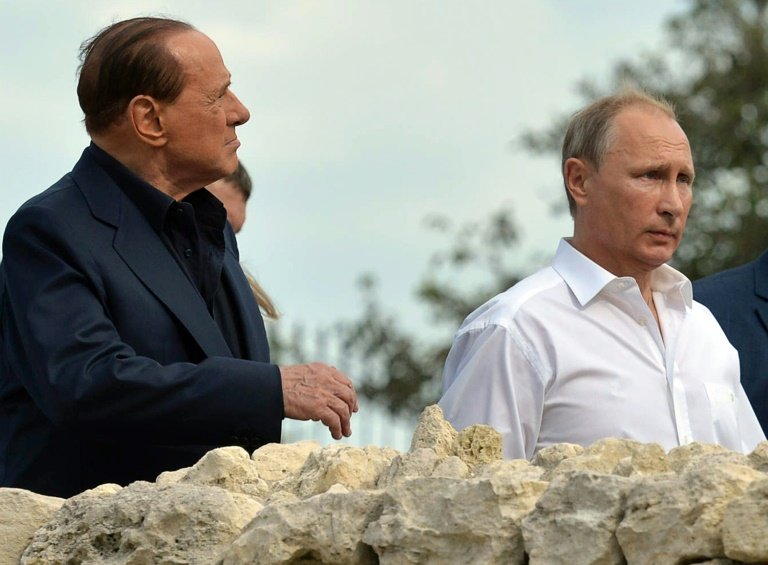 Russian President Vladimir Putin (R) tours an archeological site in Sevastopol, accompanied by Silvio Berlusconi
