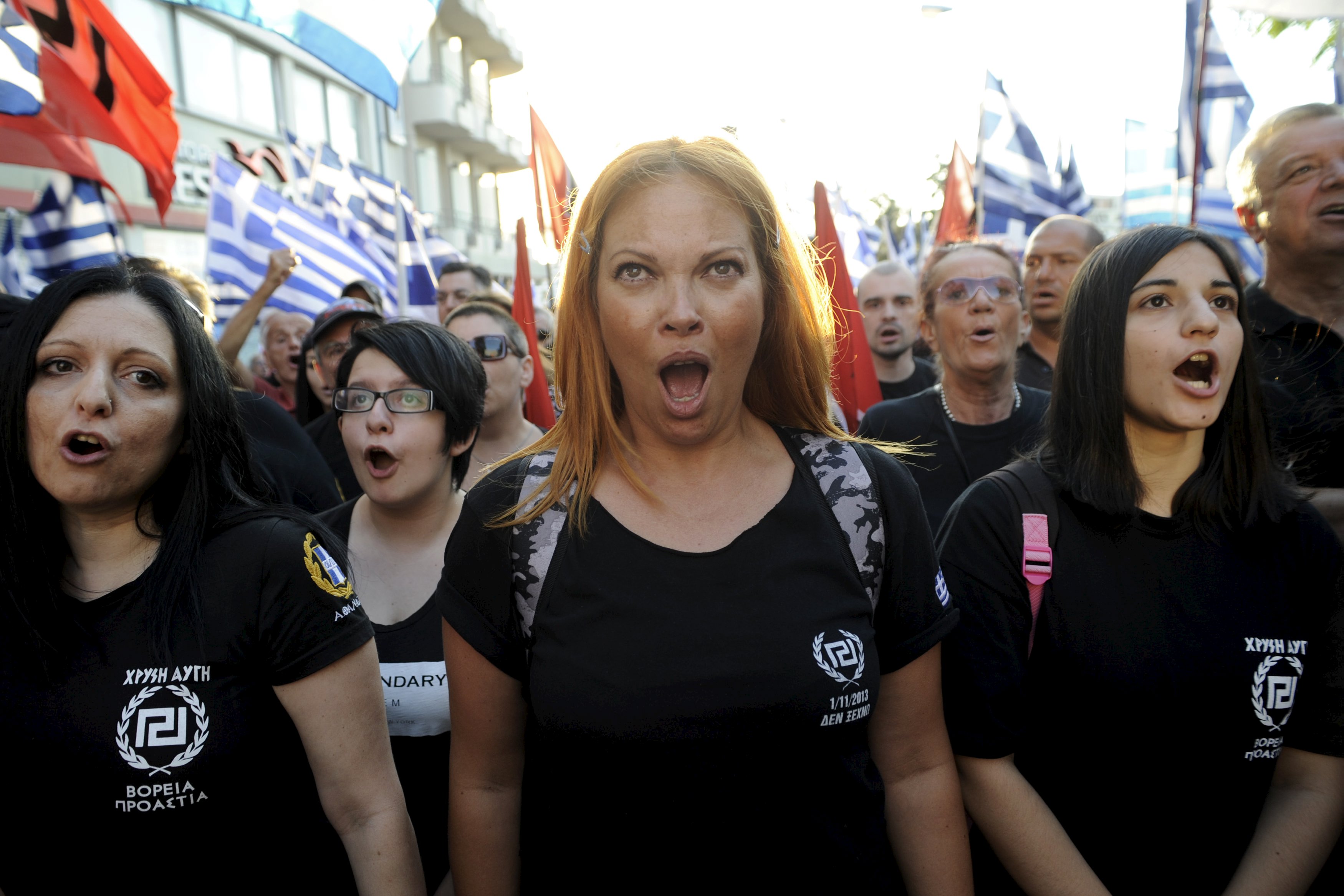 Far-right Golden Dawn party supporter shouts slogans a pre-election rally outside the party's headquarters in Athens, Greece, September 16, 2015.