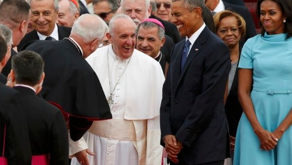 U.S. President Barack Obama and Pope Francis share a laugh as President Obama and first lady Michelle Obama (R) welcomed the Pontiff upon his arrival at Joint Base Andrews outside Washington September 22, 2015