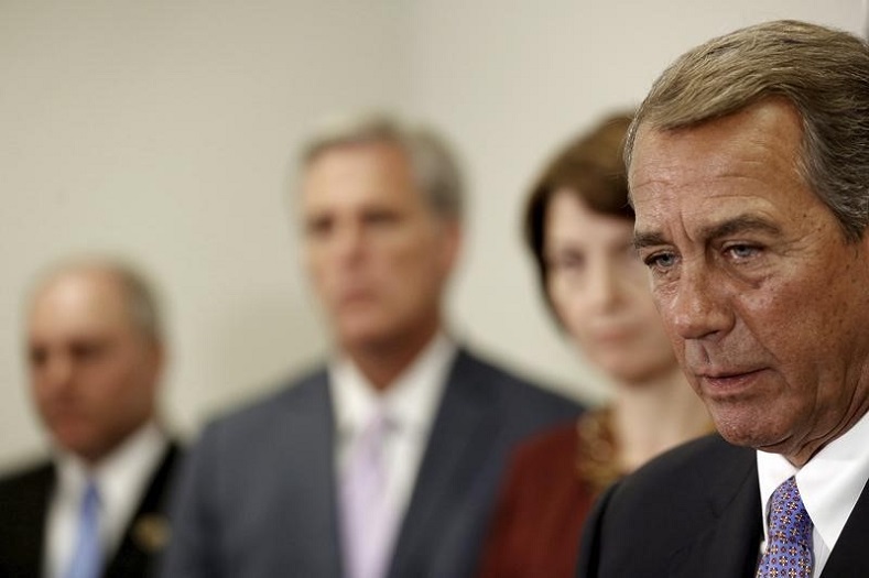U.S. House Speaker John Boehner (R-OH) (R) speaks at a news conference following a House Republican caucus meeting at the U.S. Capitol in Washington, September 9, 2015.