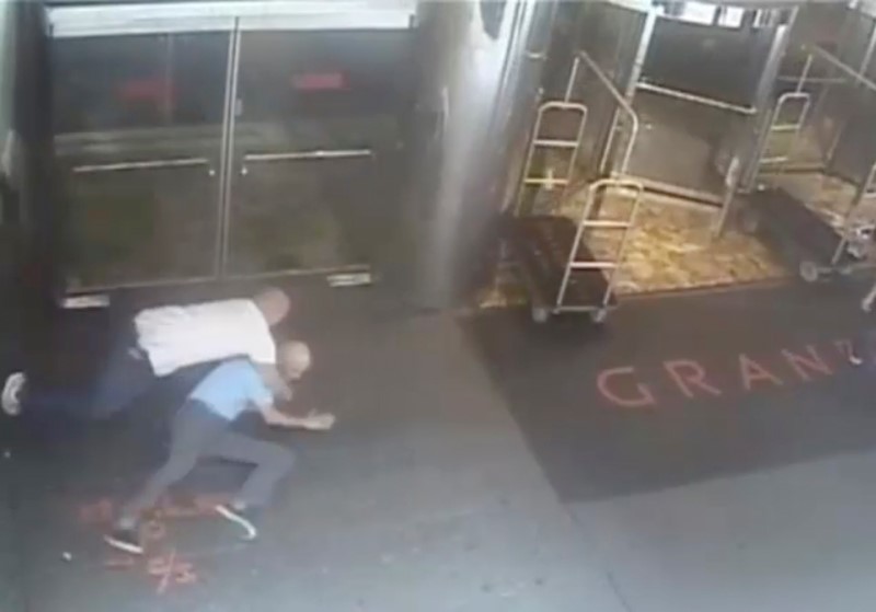 Ex-tennis star James Blake is shown tackled by a NYPD officer James Frascatore (L) in front of the Grand Hyatt hotel in New York on September 9, 2015 in this still image from a security camera video released on September 11, 2015.