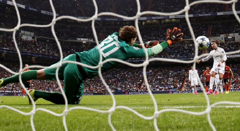 Shakhtar Donetsk's goalkeeper fails to stop the goal by Cristiano Ronaldo during their Champions League soccer match in Madrid, Spain, Sept. 15, 2015.