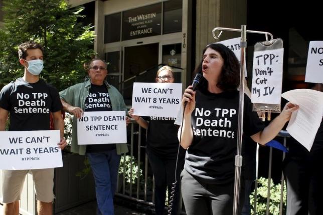 Melinda St. Louis speaks during a protest outside the hotel where the Trans-Pacific Partnership Ministerial Meetings are being held in Atlanta, Georgia, September 30, 2015.