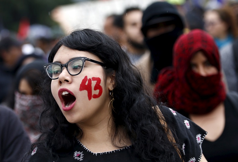A demonstrator with the number 43 written on her face, symbolizing the 43 students who were kidnapped on Sept. 26.
