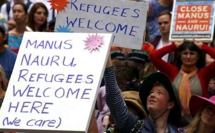Demonstrators hold placards during a rally in support of refugees that was part of a national campaign in central Sydney, Australia, on Oct 11, 2015. 