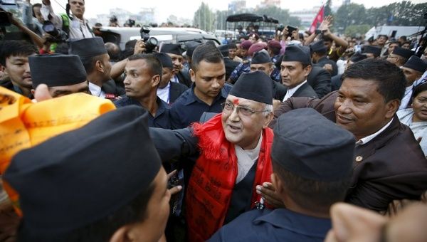 Nepal's newly elected prime minister, Khadga Prashad Sharma Oli (C), is congratulated by his supporters in Kathmandu, Nepal, Oct. 11, 2015.