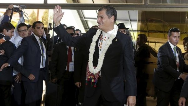 Ecuador's President Rafael Correa waves before meeting with his Bolivian counterpart Evo Morales in Tiquipaya, Bolivia, Oct. 12, 2015. 